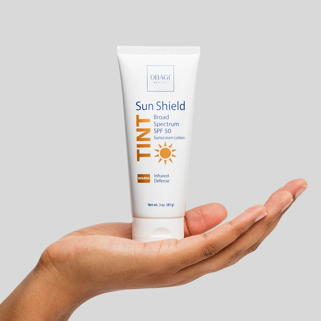 Sun Shield Tint Broad Spectrum SPF 50 Warm in model hand image